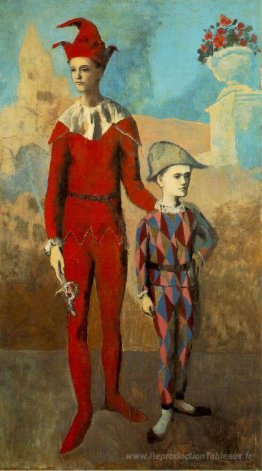Acrobat e giovane arlecchino