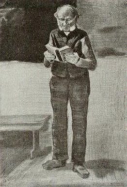 L'uomo, in piedi, che legge un libro